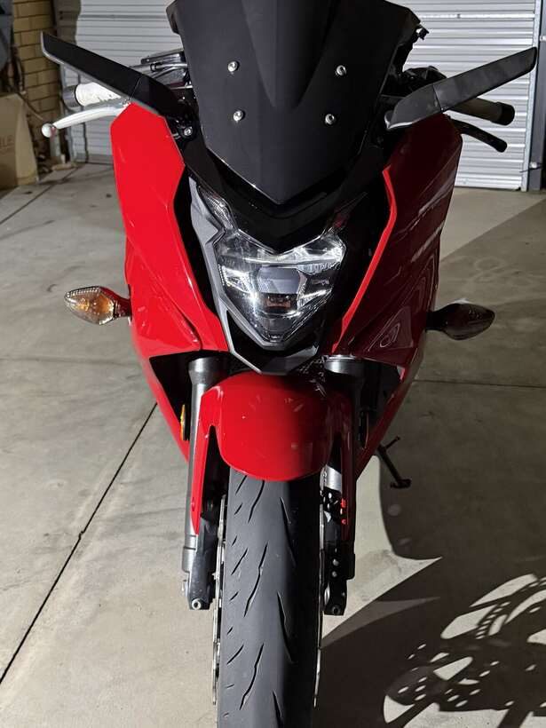 Red Honda CBR650F photographed front-on in the garage