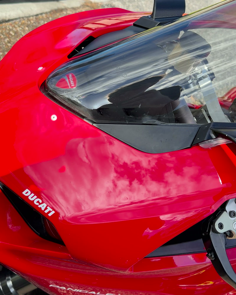 Red Ducati Panigale V2 after a full detail — glossy tank and screen in the sun
